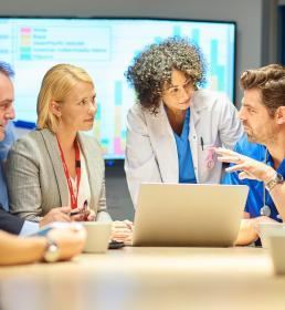 Hospital management meeting with doctors and senior managers