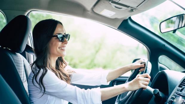 A lady driving a car